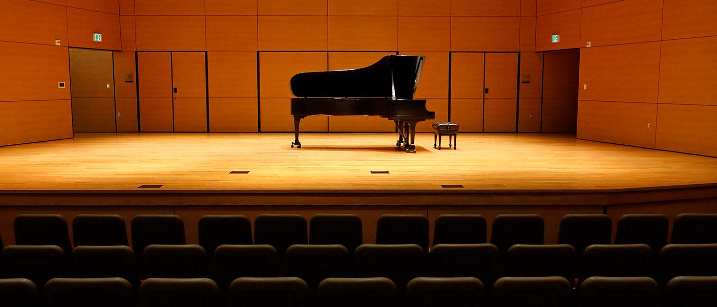 Close up view of a concert piano up on stage